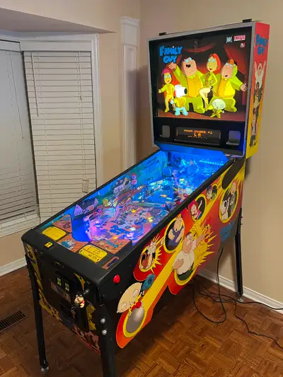 Up for sale my beautiful lightly modded HUO Family Guy pinball machine. Has a playfield protector in...