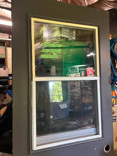 Steel door,great shape,ideal for shed or garage,window opens with screen.$100.00,phone 626-1460.