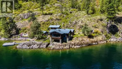One of Christina Lake's most exceptional boat-access waterfront properties. Set on a private point a...