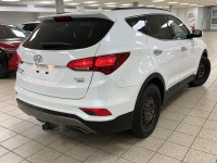 Powerful confidence wrapped in Frost Whitethis 2018 Hyundai Santa Fe 2.4 SE All-Wheel Drive SUV is e... (image 6)