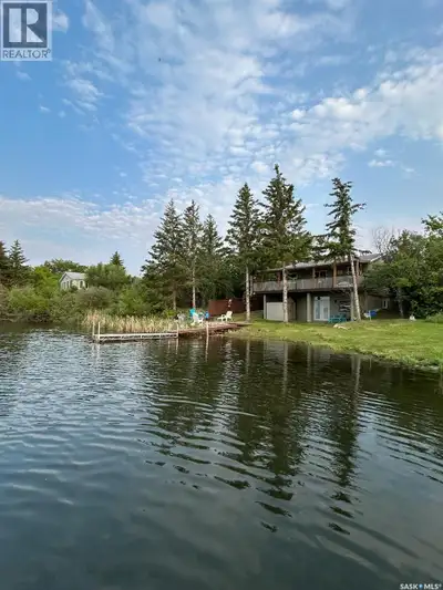 Welcome to this beautifully renovated walk-out cabin located on First Point Beach, offering the idea...