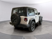 The 2026 Jeep Wrangler Sport 2 Door 4x4, presented in a striking white color, is equipped with a res... (image 4)