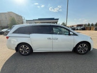 2014 Honda Odyssey Touring — White exterior, Brown interior. This Odyssey is powered by a 3.5L V6 th... (image 7)