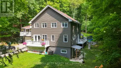 Steps to the lake Kashagawigamog. Where Timeless Elegance Meets Lakeside Serenity. Discover the pinn...