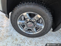 The new 2026 GMC Sierra 2500HD SLT in a bright white finish with 44 drivetrain is engineered for the... (image 6)