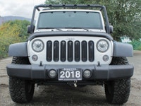 The 2018 Jeep Wrangler JK Unlimited Rubicon in stunning white with an all-wheel-drive system invites... (image 2)