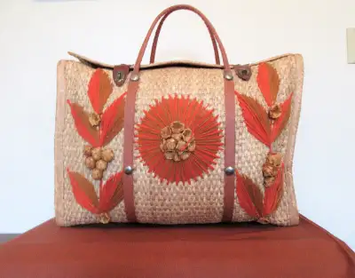 This 1960s woven straw/rattan beach bag is ready for fun on the go! The yarn flower, grapes, and lea...
