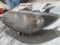 Left headlight Mazda 3 ,4dr sedan fits cars from05 to 09.