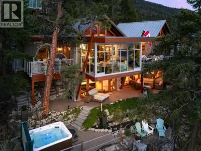 Perched above the shoreline in the exclusive Outback community, this one-of-a-kind cantilevered lake...