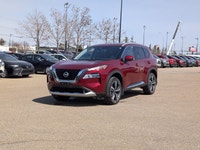 This pre-owned 2023 Nissan Rogue Platinum is finished in a beautiful Red paint with a refined Graphi... (image 1)