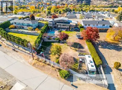Wake up to sweeping vineyard, mountain, and town views from your private haven. Set on a rare 0.50-a...