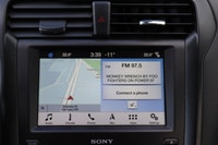 Capital Ford Lincoln Winnipeg Ltd (MB's #1 Rated Ford Store) This WHITE GOLD AWD Fusion Titanium res... (image 7)