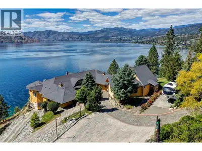 Tucked away at the end of a gated drive, this extraordinary waterfront estate is set on 2.5 private...