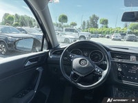 Navigate every journey with confidence and ease in the striking Black 2018 Volkswagen Tiguan Trendli... (image 5)