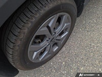 Embrace the thrill of the open road with this 2024 Kia Seltos EX, a vibrant green SUV boasting a rem... (image 8)