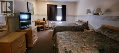 * VERY RARE OPPORTUNITY TO OWN A NEWER SMALL SIZE MOTEL JUST 10 MIN TO AIRDRIE AND 20 MIN TO CALGARY...