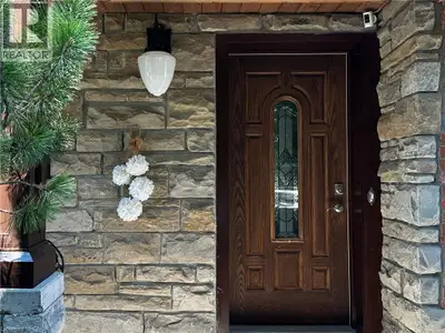 Custom-built dream home with a stunning view and a truly unique layout! Wake up to the peaceful beau...