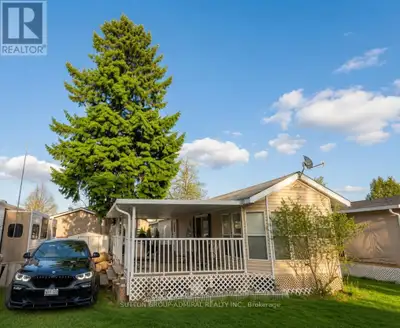 Beautiful two-bedroom fully furnished mobile home in a quiet trailer park. This 44-foot trailer look...