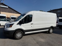 Ready for work. This mid roof transit has power options, divider, bluetooth, a/c, back up camera and... (image 8)