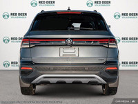 Meet the 2025 Volkswagen Taos Trendline 4MOTION, a stunning new gray SUV that excels in all-wheel dr... (image 4)