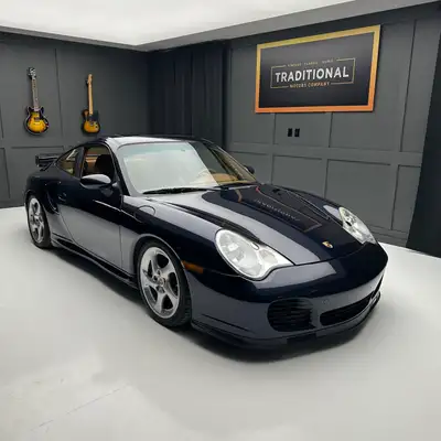 Check out this 2003 Porsche 911 Twin Turbo. This is the very desirable Midnight Blue Metallic with N...