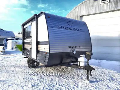 Keystone Hideout Mini travel trailer 120BT highlights: Bar Table Full-Size Bed 8' Power Awning 3.3 C...