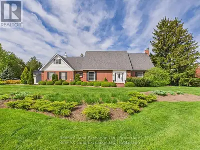 Welcome to Lake Huron Highlands! This charming custom-built red brick traditional home features thre...