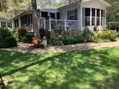 Looking for a seasonal getaway? This large and beautifully maintained 12 x 45 Huron Ridge Park Model...