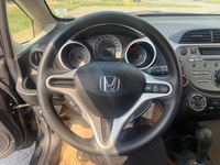 A practical subcompact hatchback with excellent fuel efficiency, easy maneuverability, and a surpris... (image 9)