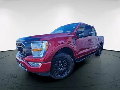 Experience the power and versatility of the 2021 Ford F-150 XLT in a striking red finish with a robu...