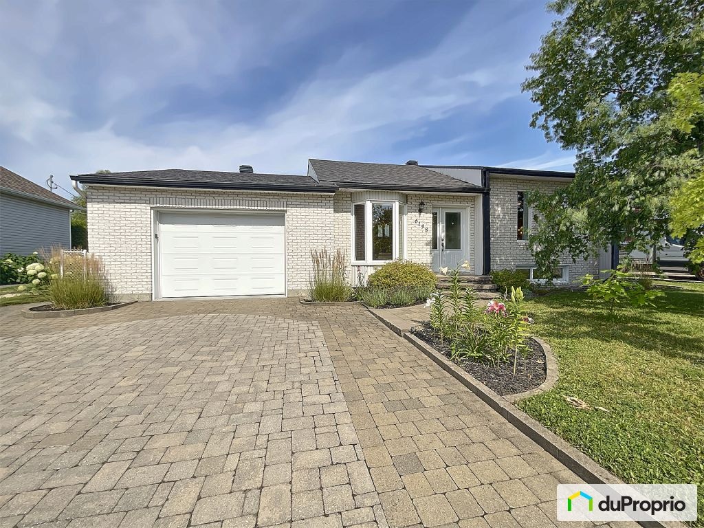$550,000 - Bungalow for sale in St-Emile — photo 1