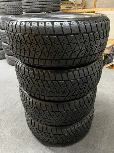 Good set of Bridgestone Blizzak DM-V2 winter tires. 255/55/20 3 x 8-9/32nd tread remaining 1 x 11/32...