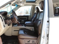 This 2014 Ram 3500 Longhorn is a local trade-in with two keys and lom km's, under the hood sits the... (image 1)