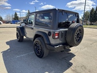This Jeep Wrangler delivers a Gas/Electric V-6 3.6 L/220 engine powering this Automatic transmission... (image 4)