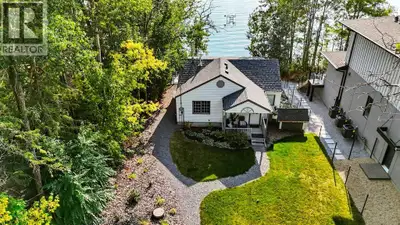 Welcome to your dream lakefront getaway on the sunny side of Sylvan Lake. Set on a level 50 x 203 ft...
