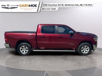 Experience the bold presence of the 2023 Ram 1500 Laramie in stunning red with the unstoppable 44 dr... (image 1)