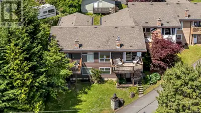 Immediate Possession Available! This spacious 2-bedroom + den, 2-bathroom townhouse in Sherman Grove...