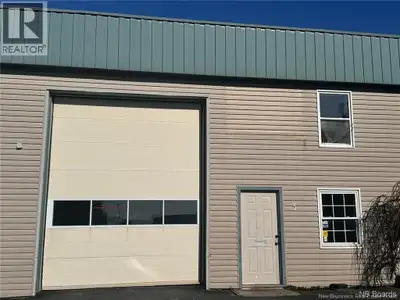 Workshop/ garage/ store space available for rent on Rothesay Avenue with 13' tall bay door and 2 EV...