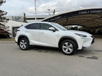 The NX 200t is characterized by its aggressive "spindle" grille and sharp, angular body lines. As th... (image 1)