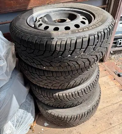 (4) 195 65 15 General Altimax Snow Tires mounted on steel rims. + 90 percent tread, Dot 3217 In exce...