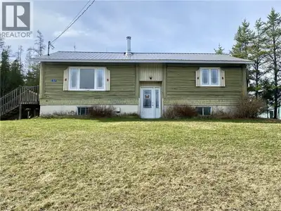 Character & Incredible Upside! Forget cookie-cutter. This home features a rugged log-style exterior...