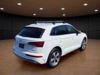 The 2021 Audi Q5 Komfort 45 TFSI quattro boasts a stunning white exterior that is both timeless and... (image 5)