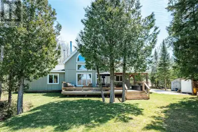 Some homes feel like they belong exactly where they are. This TIMBER FRAME CHALET on MILLER LAKE is...