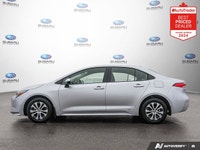 Odometer is 1478 kilometers below market average! Gray 2025 Toyota Corolla Hybrid LE AWD Continuousl... (image 1)