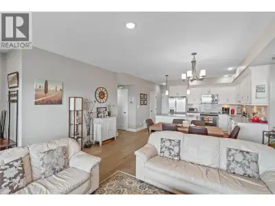 Step into unit #27, a pristine 1,478 sq. ft. level-entry townhome that perfectly balances luxury and...