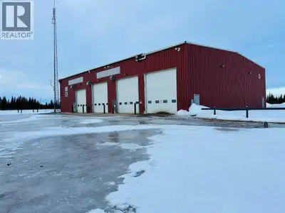 Almost 8 Acres and 4 drive through shop bays and a 10 ton crane on busy highway 2 all for a fraction...