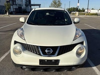 This 2012 Nissan Juke (JAPANESE)is a reliable SUV with a stylish white exterior and a sleek black in... (image 5)