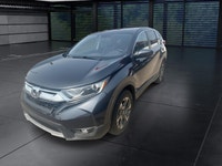 The 2018 Honda CR-V EX-L AWD in striking gray is the perfect blend of versatility and style, designe... (image 4)