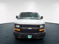 The 2017 Chevrolet Express Cargo Van in a classic white, rear-wheel drive design is tailored for tho... (image 2)