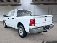This commanding 2023 Ram 1500 Classic SLT Crew Cab Pickup, shimmering in Bright White with a functio... (image 4)
